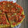 Polenta quiche with lentils, tomatoes and bell peppers